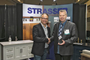 LPG Executive Director Jeff MacDowell presents the “Best Booth Award” to Strasser Vice President of Sales Peter Ollestad