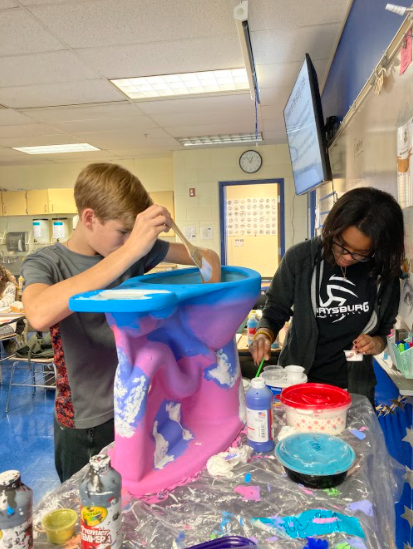 PHS students paint toilets for Waterhouse
