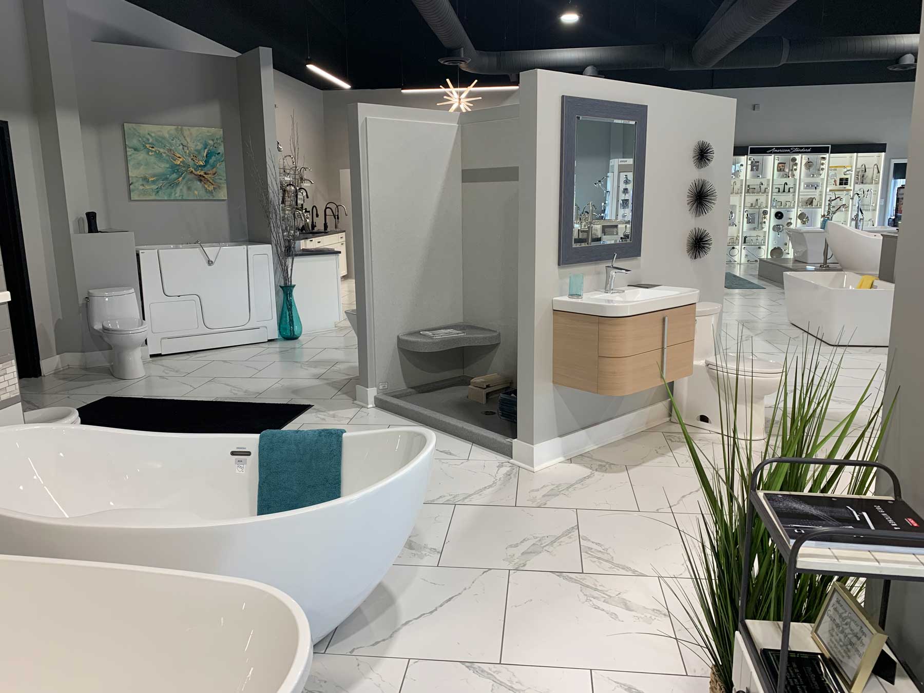 Photo-Sep-04,-1-23-06-PM A spacious bathroom featuring a large tub and a stylish sink, creating a relaxing and functional space.