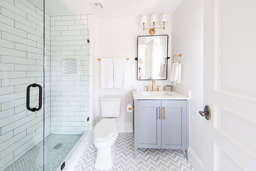 newhalem-156-1 A bathroom featuring white tile and a stylish gray and gold chevron pattern on the walls.